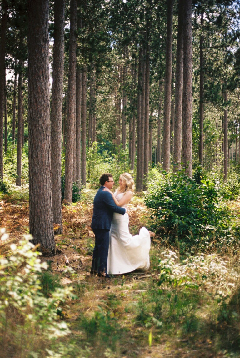 a bride and groom on film at their wedding in northern michigan