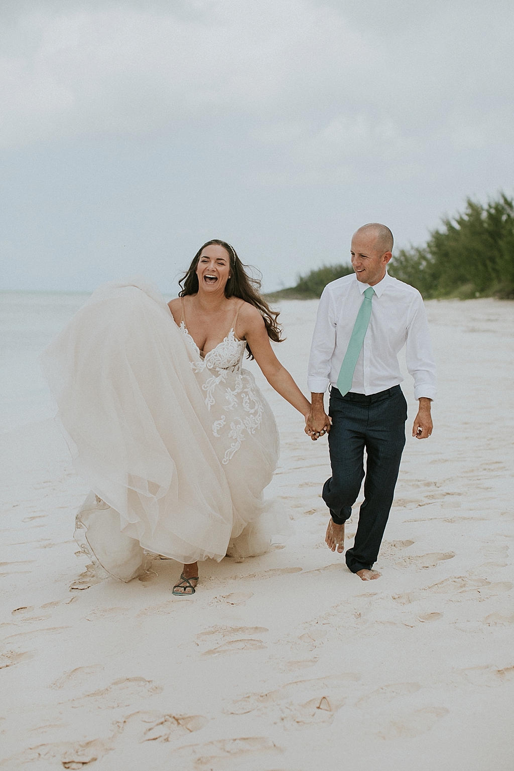 happy bride and groom on the beach