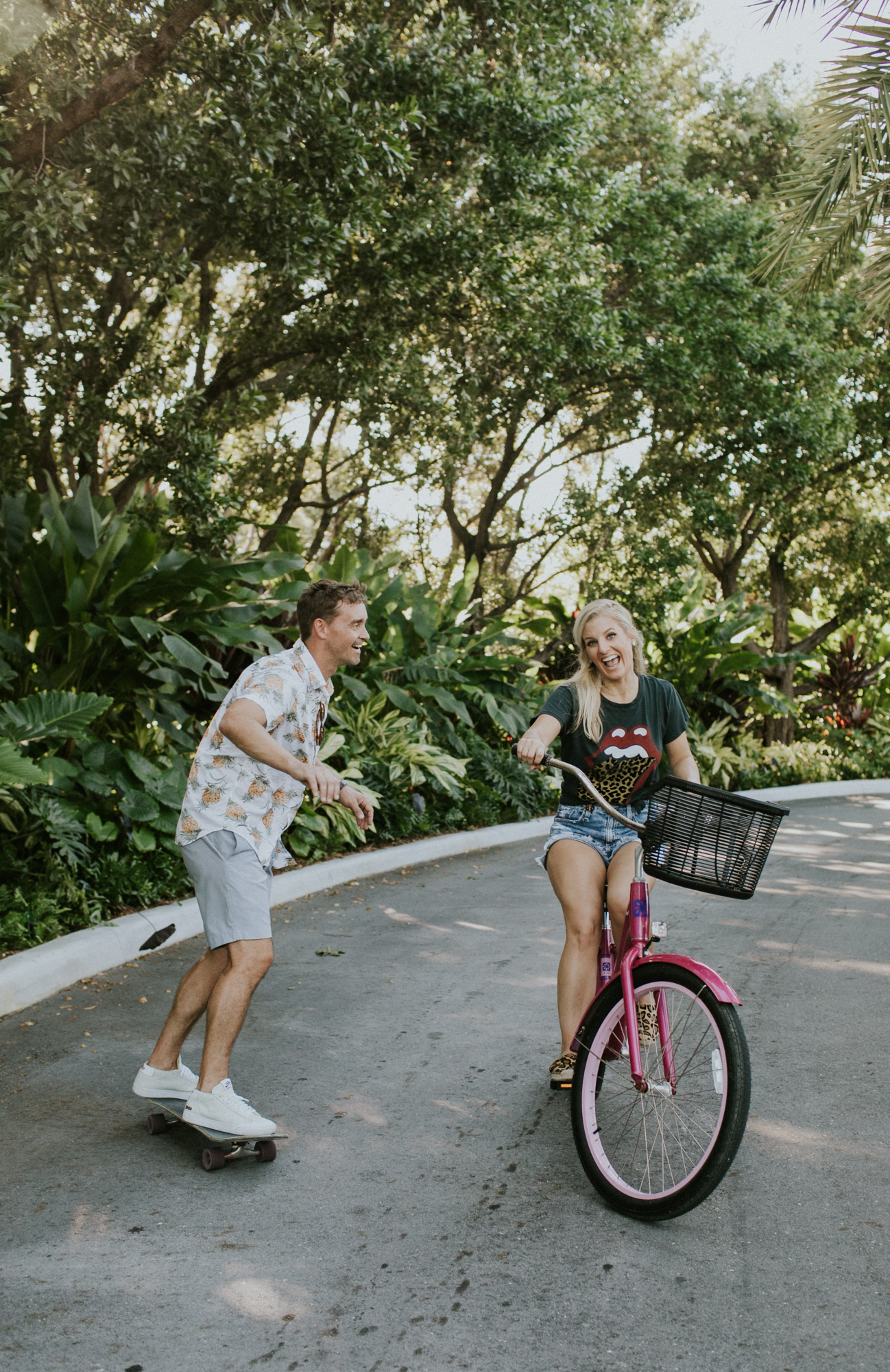 Cute couple riding bikes during their engagement session