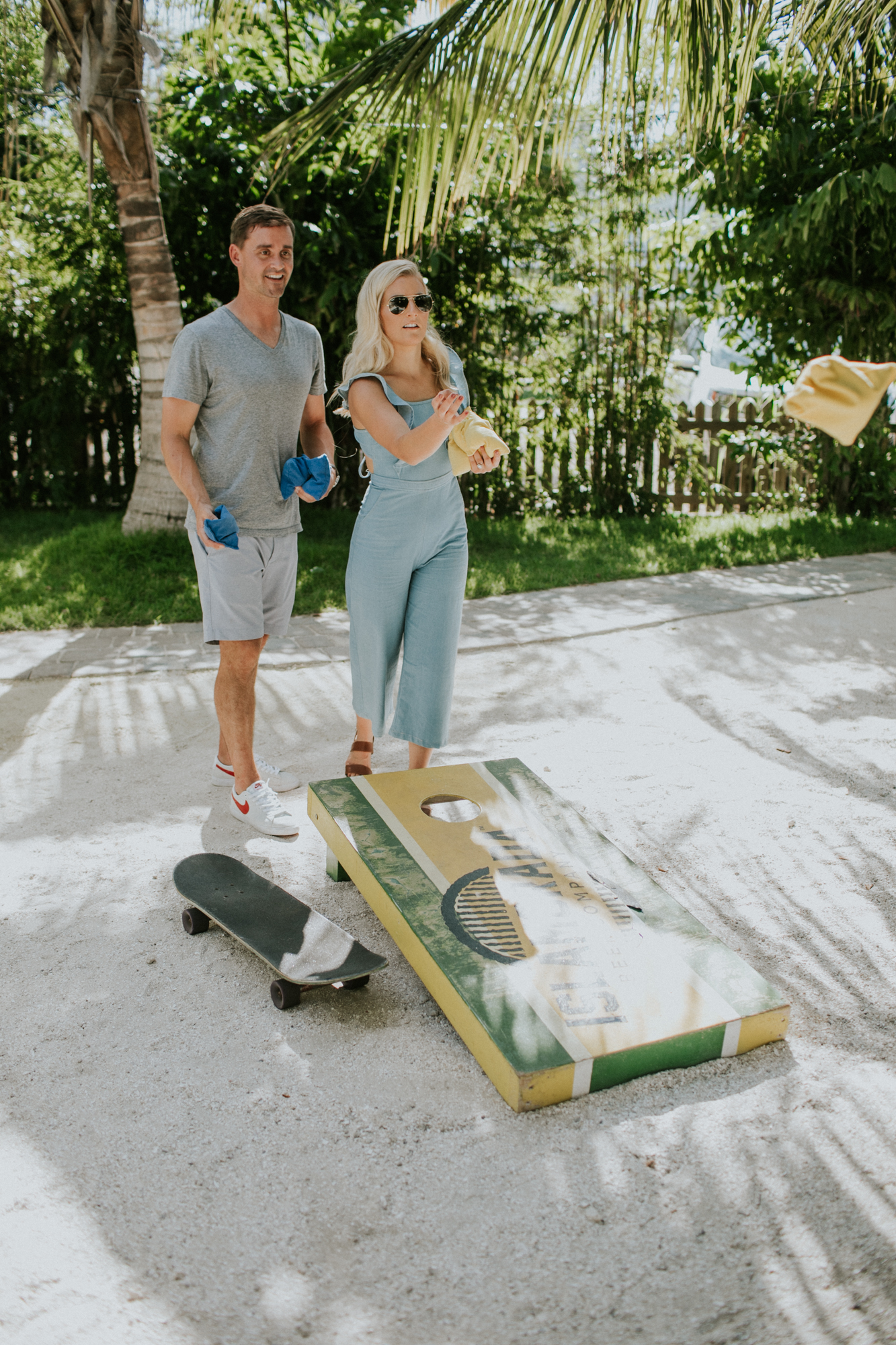 Cornhole game during an engagement shoot in the florida keys